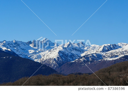 France, Ariege, Mountains Pyrenees, winter sports scene, skiers on the slopes 87386596