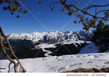 France, Ariege, Mountains Pyrenees, winter sports scene, skiers on the slopes France, Ariege, Mountains Pyrenees, winter sports scene, skiers on the slopes 87386602