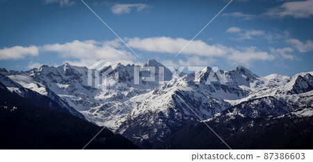France, Ariege, Mountains Pyrenees, winter sports scene, skiers on the slopes 87386603