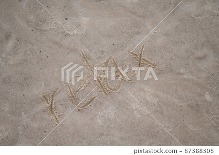 The inscription relax on the yellow sand. Holiday concept at sea. The inscription relax on the yellow sand. Holiday concept at sea. 87388308