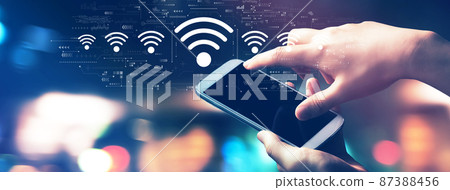 Wifi theme with city lights at night Wifi theme with city lights at night 87388456