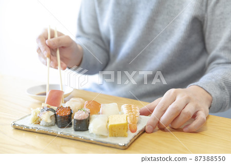 Variations of men eating sushi Variations of men eating sushi 87388550