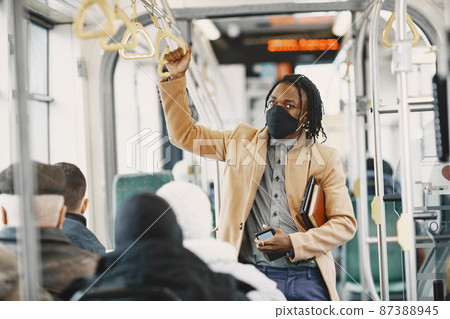Young African businessman in a bus 87388945