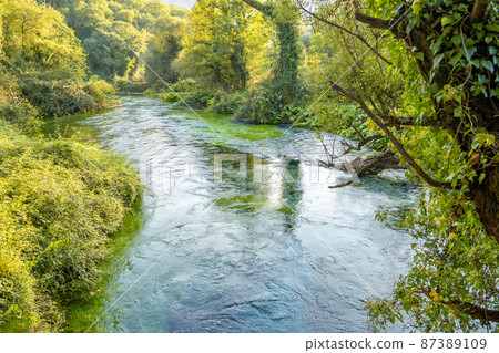 The Blue Eye spring, a more than fifty metre deep natural pool with clear, fresh water 87389109