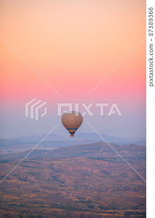 Bright hot air balloons in sky of Cappadocia, Turkey 87389366