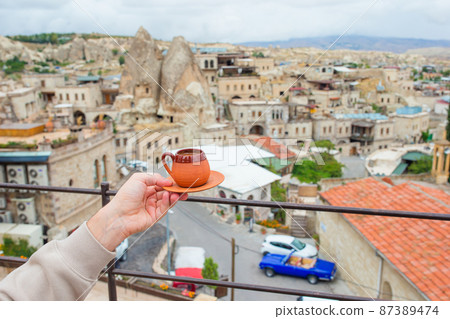 Cup with traditional Turkish coffee on a background of a valley in Cappadocia, Turkey. 87389474