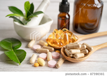 Alternative medicine herbal organic capsule with vitamin E omega 3 fish oil, mineral, drug with herbs leaf natural supplements for healthy good life. 87390381