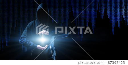 Cyber security hacker concept. Internet web hack technology. Blurred Hacker man hand isolated on black with flare ray flash effect. Data protection, secured internet access, cybersecurity. 87392423