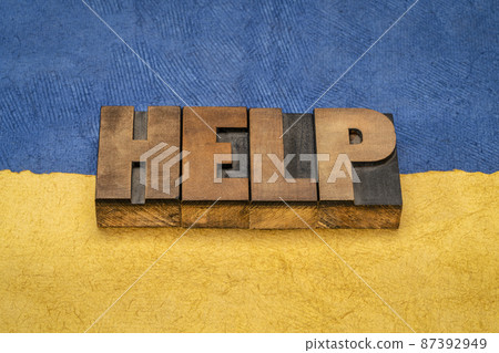 help word abstract against Ukrainian national flag help word abstract against Ukrainian national flag 87392949