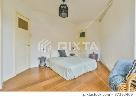 Practical bedroom with large mattress and soft pillows Practical bedroom with large mattress and soft pillows 87393469