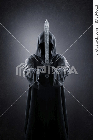 Warrior with hooded cape and medieval sword over dark misty background Warrior with hooded cape and medieval sword over dark misty background 87394013