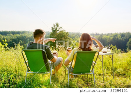 Happy middle aged couple relaxing together outdoor Happy middle aged couple relaxing together outdoor 87394161