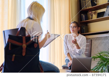 Young teenage female on therapy in a psychologist's office. Young teenage female on therapy in a psychologist's office. 87394171