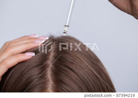 Portrait of young beautiful woman with long hair 87394219