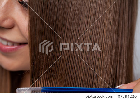 Portrait of young beautiful woman with long hair Portrait of young beautiful woman with long hair 87394220