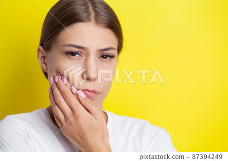 Beautiful Sad Girl Suffering From Strong Tooth Pain 87394249