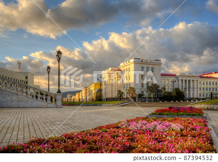 Scenic morning cityscape. View of the square and old buildings in the city of Magadan. 87394532