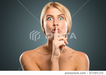 Portrait beautiful blond woman with long hair and blue eyes 87395135