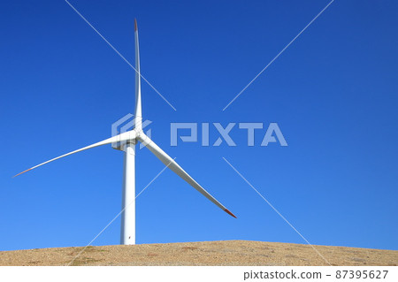 Wind power generation on a hill 87395627