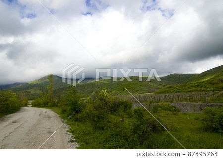 A path in a rural landscape with meadows in Crimea. Ukraine A path in a rural landscape with meadows in Crimea. Ukraine 87395763