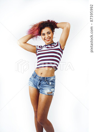young happy smiling latin american teenage girl emotional posing on white background, lifestyle people concept 87395992