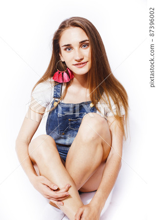 young pretty blond teenage girl emotional posing, happy smiling isolated on white background, lifestyle people concept young pretty blond teenage girl emotional posing, happy smiling isolated on white background, lifestyle people concept 87396002