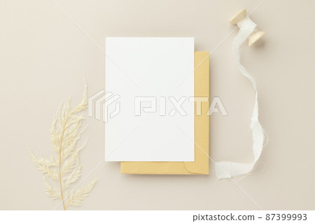 Blank greeting card invitation Mockup 5x7 on Brown envelope with dried flowers on beige background, flat lay, mockup Blank greeting card invitation Mockup 5x7 on Brown envelope with dried flowers on beige background, flat lay, mockup 87399993