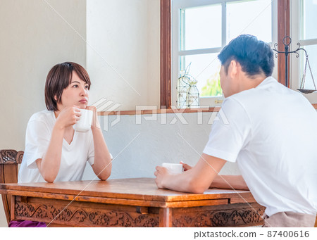 A relaxing couple with a serious expression A relaxing couple with a serious expression 87400616