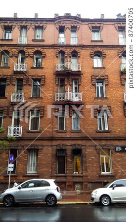 Facade view of a neoclassical brick building, in Republica Arabe and Cabello streets. Buenos Aires, Argentina 87400705