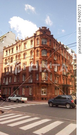 Facade view of a neoclassical brick building, in Republica Arabe and Cabello streets. Buenos Aires, Argentina Facade view of a neoclassical brick building, in Republica Arabe and Cabello streets. Buenos Aires, Argentina 87400715
