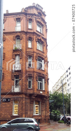 Facade view of a neoclassical brick building, in Republica Arabe and Cabello streets. Buenos Aires, Argentina Facade view of a neoclassical brick building, in Republica Arabe and Cabello streets. Buenos Aires, Argentina 87400725