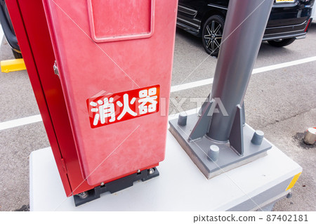 A photo of a mobile powder fire extinguishing system installed in a multi-storey car park in a commercial facility. Image of firefighting equipment. A photo of a mobile powder fire extinguishing system installed in a multi-storey car park in a commercial facility. Image of firefighting equipment. 87402181