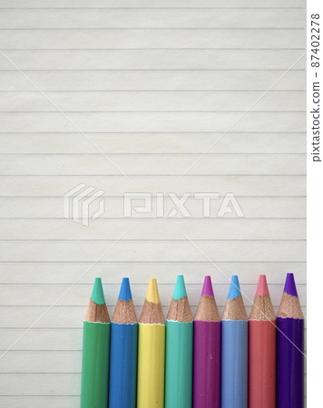 Notebooks and pastel colored pencils Notebooks and pastel colored pencils 87402278