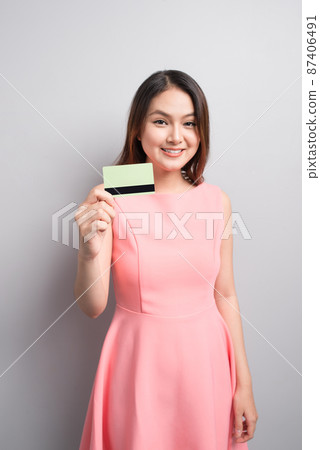 Charming asian woman hand show credit card. Presenting your product. 87406491