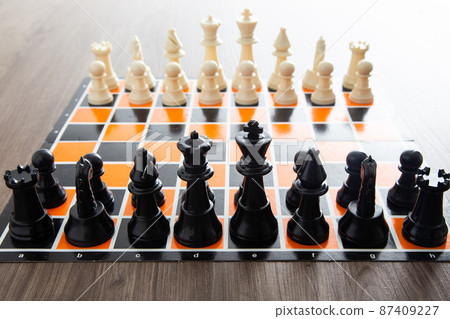 Chess board game on wooden table 87409227