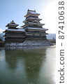 Matsumoto Castle and moat in the snowy landscape 87410638