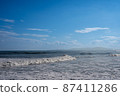 Blue sky and white rippling sea 87411286