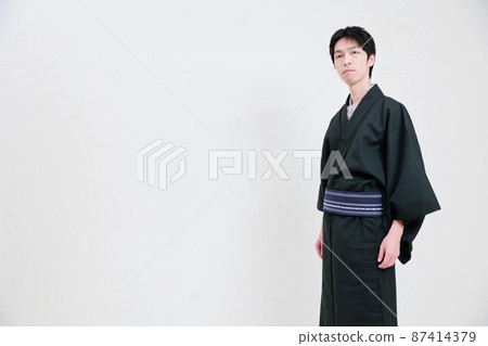 Japanese man in kimono and white background Japanese man in kimono and white background 87414379