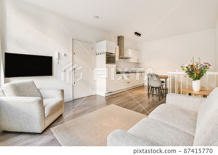 A mind-blowing little living room with a light sofa and a beige little carpet A mind-blowing little living room with a light sofa and a beige little carpet 87415770