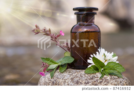 Natural herbal medicine - bootle and flower. Natural herbal medicine - bootle and flower. 87416932