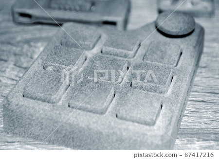 Different objects printed on industrial powder 3D printer. Multi Jet Fusion MJF Different objects printed on industrial powder 3D printer. Multi Jet Fusion MJF 87417216