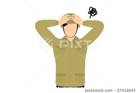 Male soldier poses, holding his head and worried 87418645