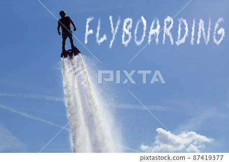 Man posing at new flyboard - the inscription "flyboard" Man posing at new flyboard - the inscription "flyboard" 87419377