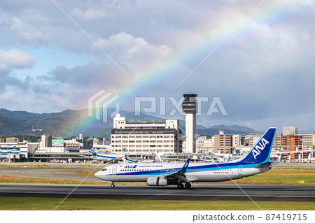 Passenger plane landing at Osaka Airport, ANA, Boeing 737, Rainbow Passenger plane landing at Osaka Airport, ANA, Boeing 737, Rainbow 87419715