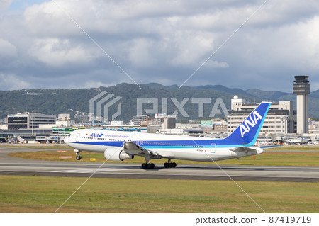Passenger plane taking off from Osaka Airport, ANA, Boeing 767 Passenger plane taking off from Osaka Airport, ANA, Boeing 767 87419719