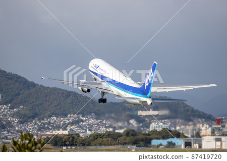 Passenger plane taking off from Osaka Airport, ANA, Boeing 767 Passenger plane taking off from Osaka Airport, ANA, Boeing 767 87419720