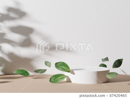 White round podium with leaves, flying in the air, on white background. Natural podium for product, cosmetic presentation. Mock up. Pedestal or platform for beauty products. Empty scene. 3D rendering. 87420465