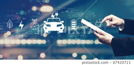 EV concept with businessman using a tablet 87420721