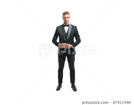 full length of grizzled man butler in formal tuxedo isolated on white 87421496