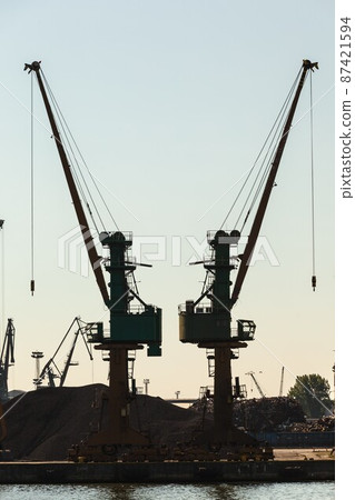 Cranes in morning harbour. Cranes in morning harbour. 87421594